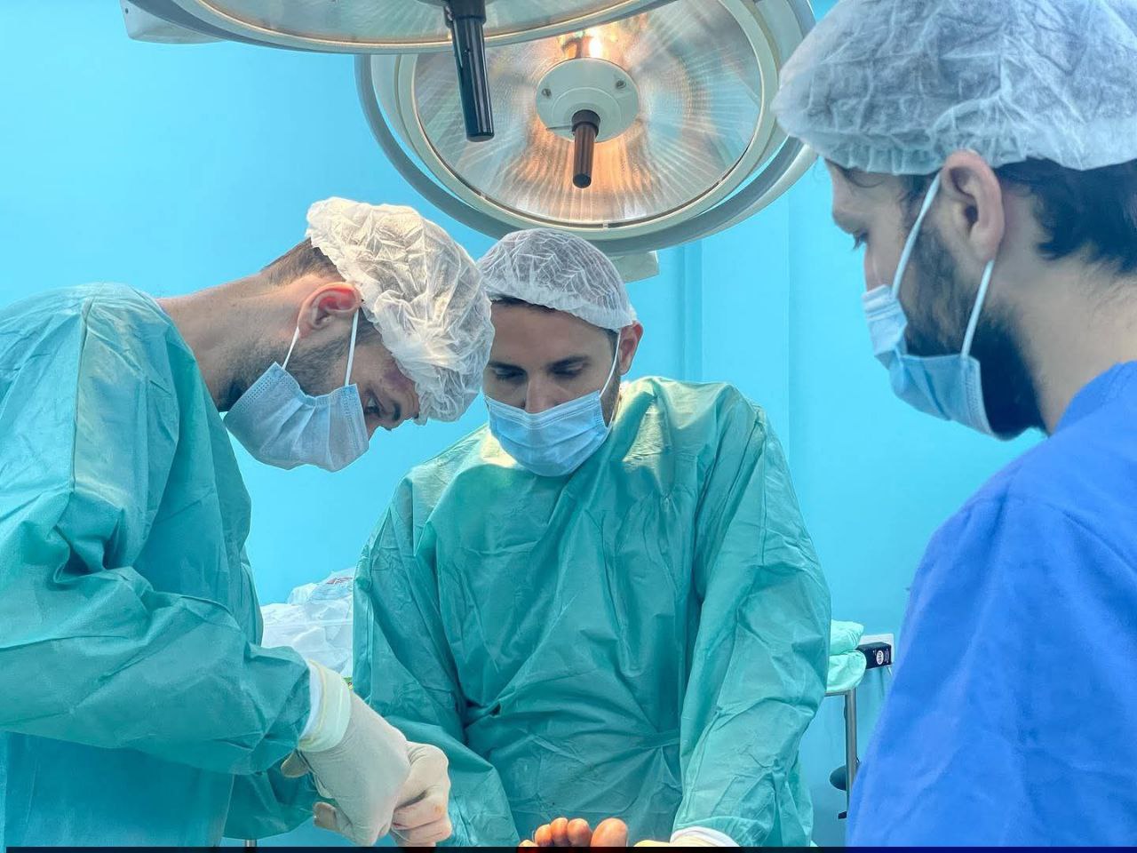Surgeons performing operation